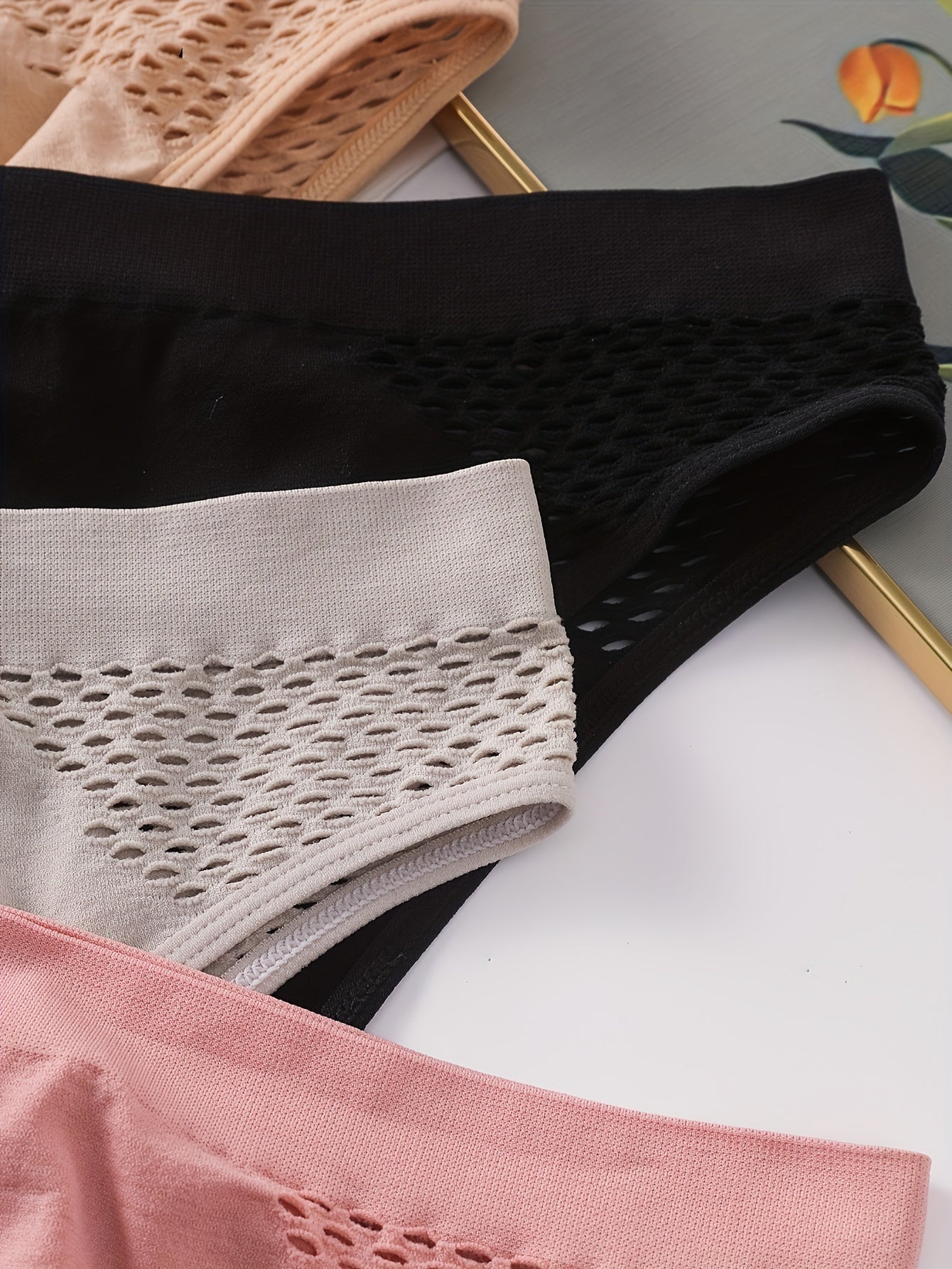 Set of 4 Mixed Color Low-Rise Women'S Underwear with a Hollow Design, Sporty Style, Seamless, Suitable for And, Featuring a Unique Triangle Cut.