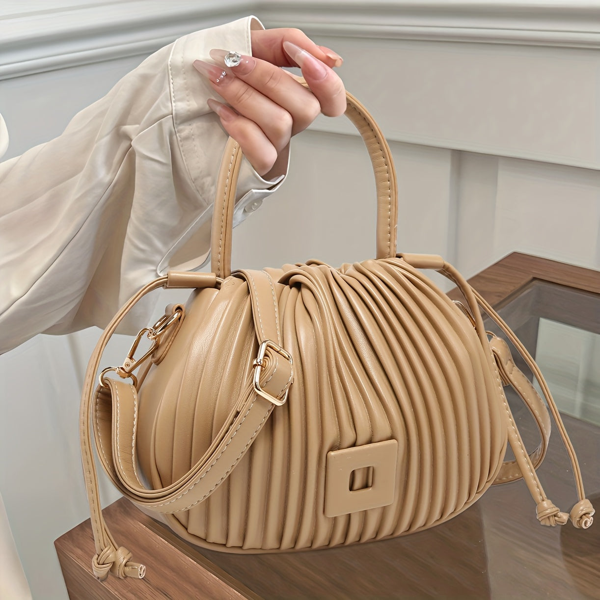 The Terilte Women'S Drawstring Bucket Bag Is a Pleated Handbag That Can Also Be Used As a Crossbody Bag. It Features a Detachable Shoulder Strap, Allowing for Easy Transitions Between a Handbag, Shoulder Bag, And Crossbody Ba